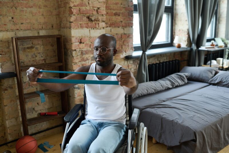 Man exercising during rehabilitation at home